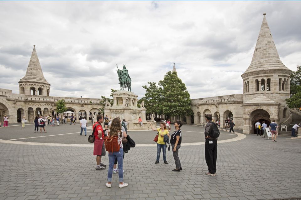 Budapest: Castle District Walk with Matthias Church Entry - Royal Palace energy: courtyards, the Presidential Palace area, and Disz Square