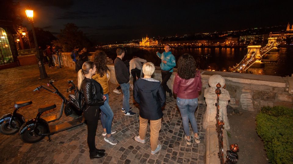 Budapest: Night Tour on MonsteRoller e-Scooter - Castle-bazaar stop: the first slice of the Castle Hill mood